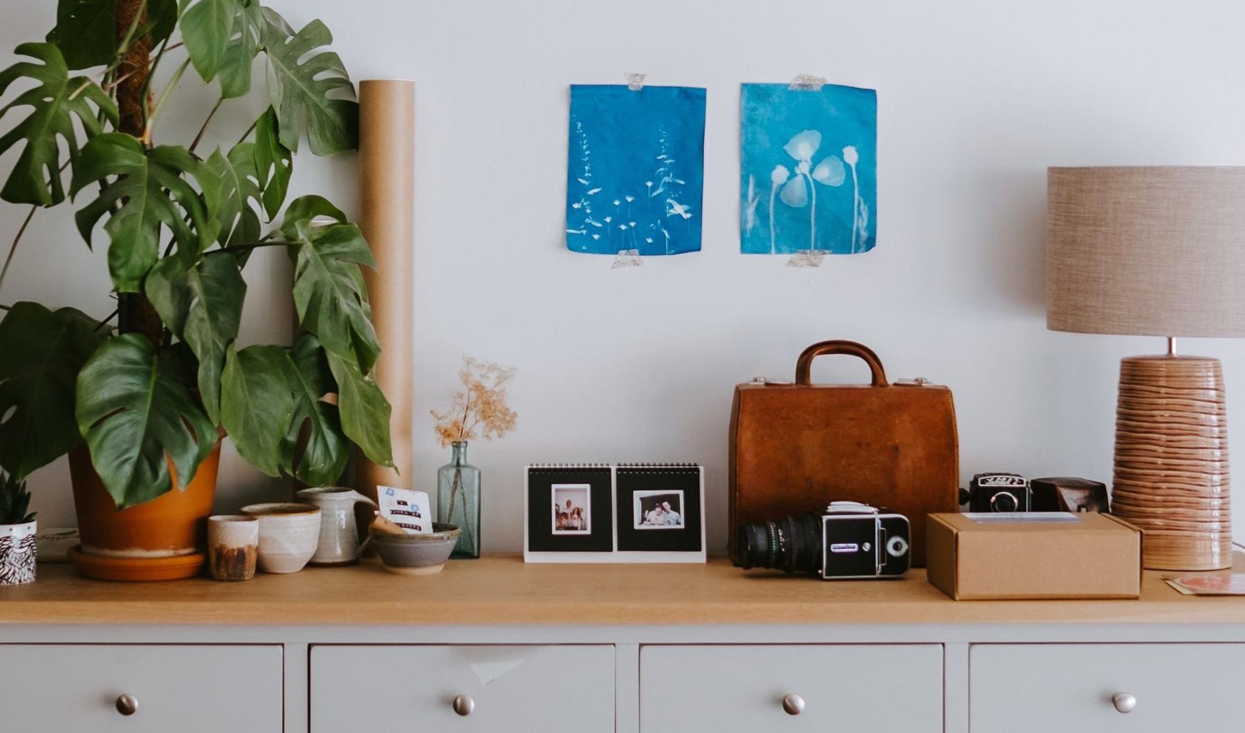 large dresser with a variety of decor on it